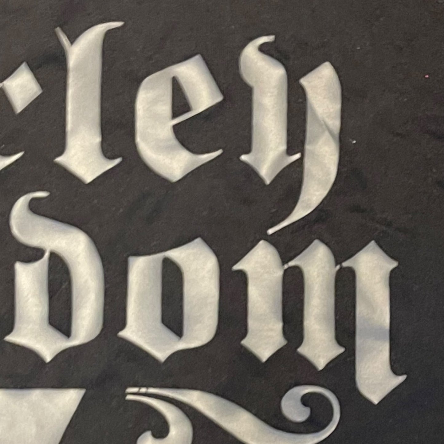 Close up of issues with text on shirt