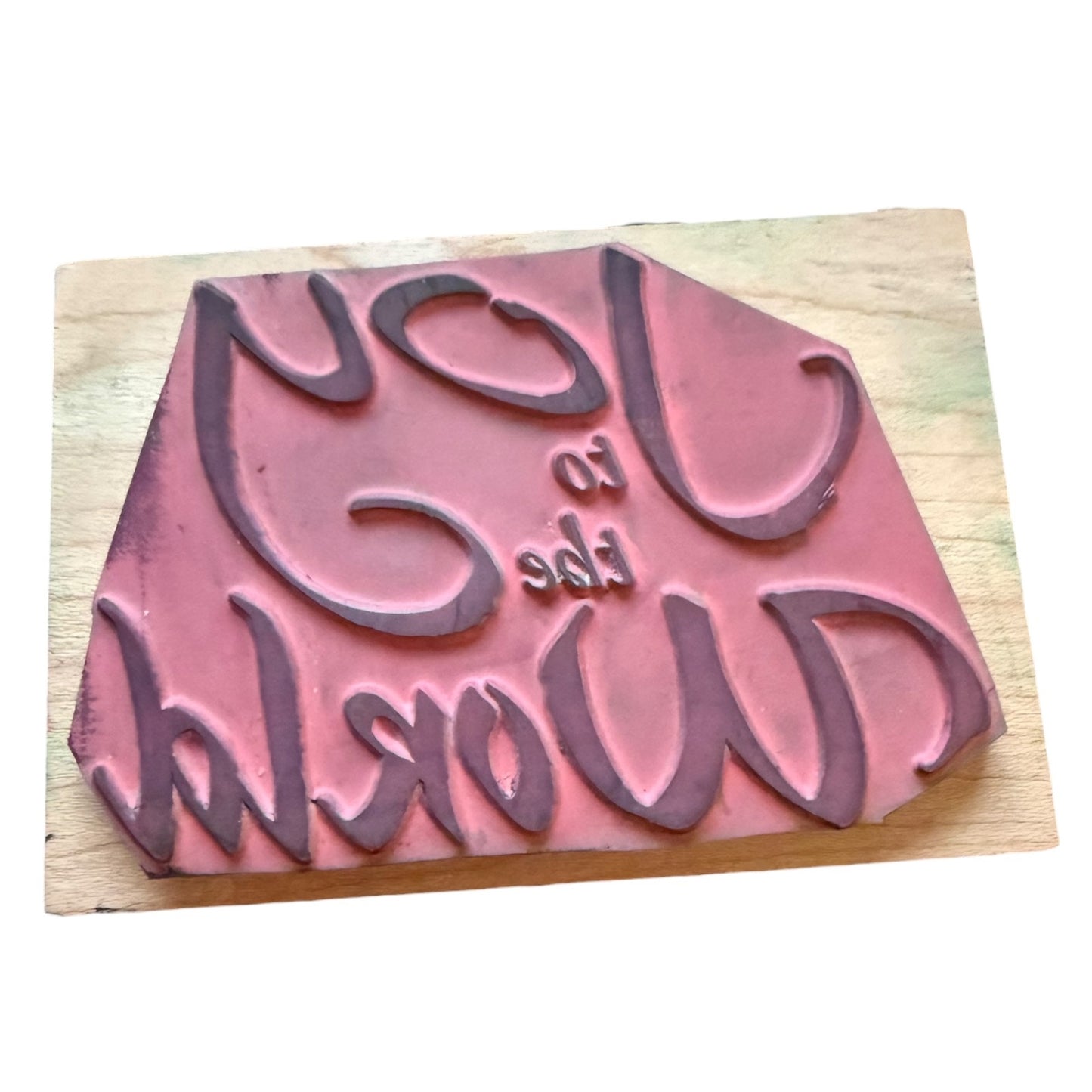 Wooden stamp with text on a wooden block