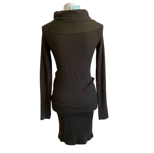 Back of green bodycon dress with long sleeve on a white background.