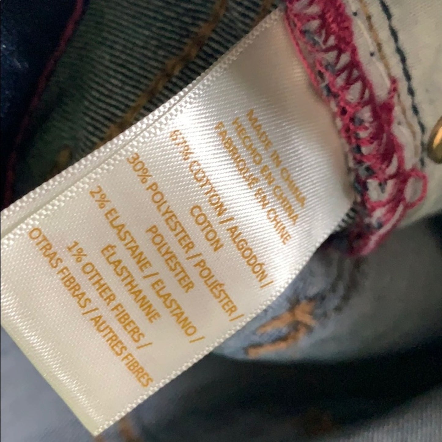 Fabric label with material composition details on a textured background