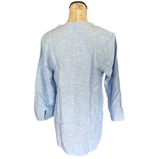 Light blue tunic shirt on a mannequin against a white background
