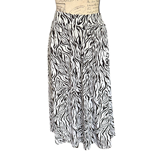 Black and white zebra print skirt on a mannequin against a white background