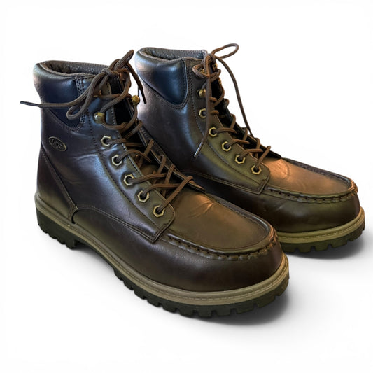 Pair of brown leather boots with laces on a white background