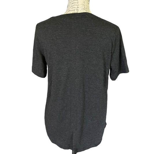 A dark gray short-sleeve t-shirt displayed on a cream-colored dress form mannequin against a plain white background.