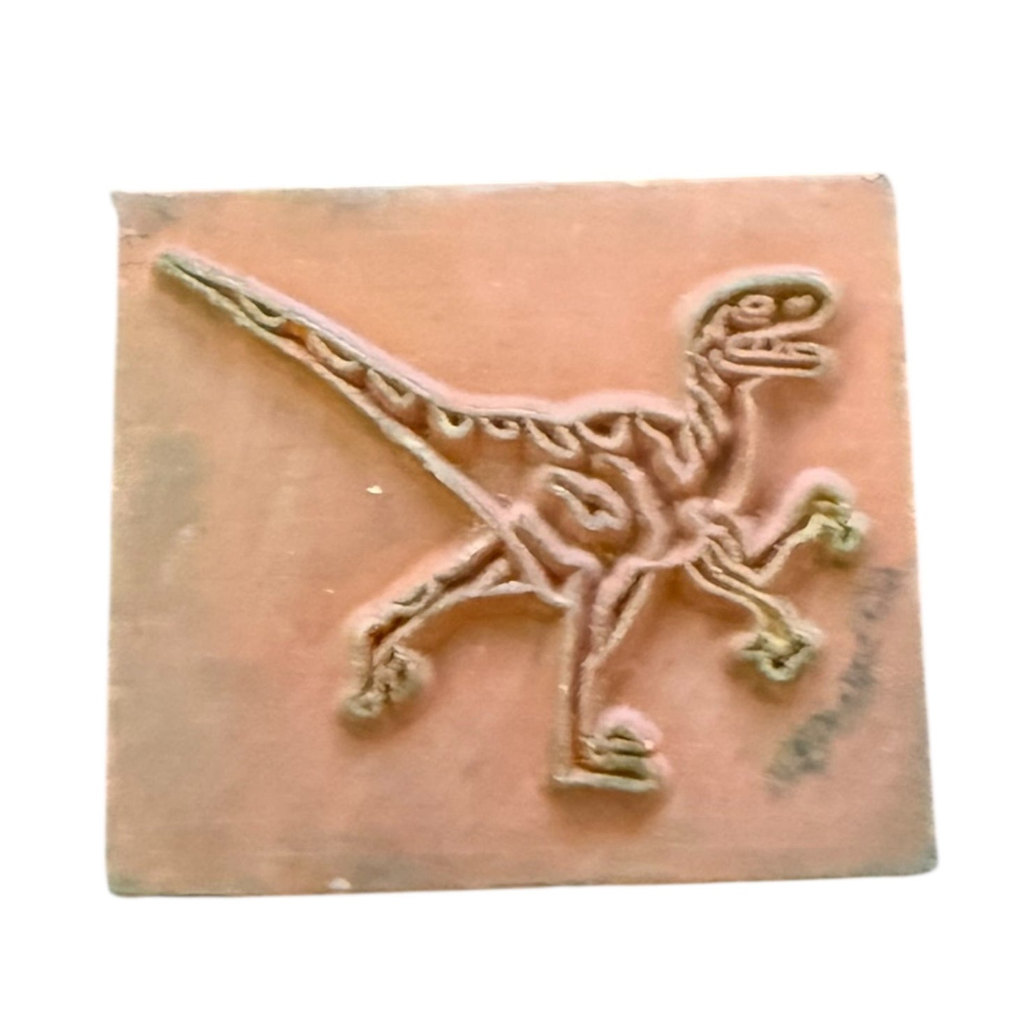 Decorative dinosaur design rubber stamp on a white background