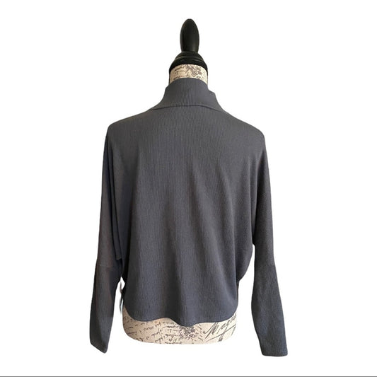 A dark gray ribbed top displayed on a mannequin torso, showing the back view against a plain white background.