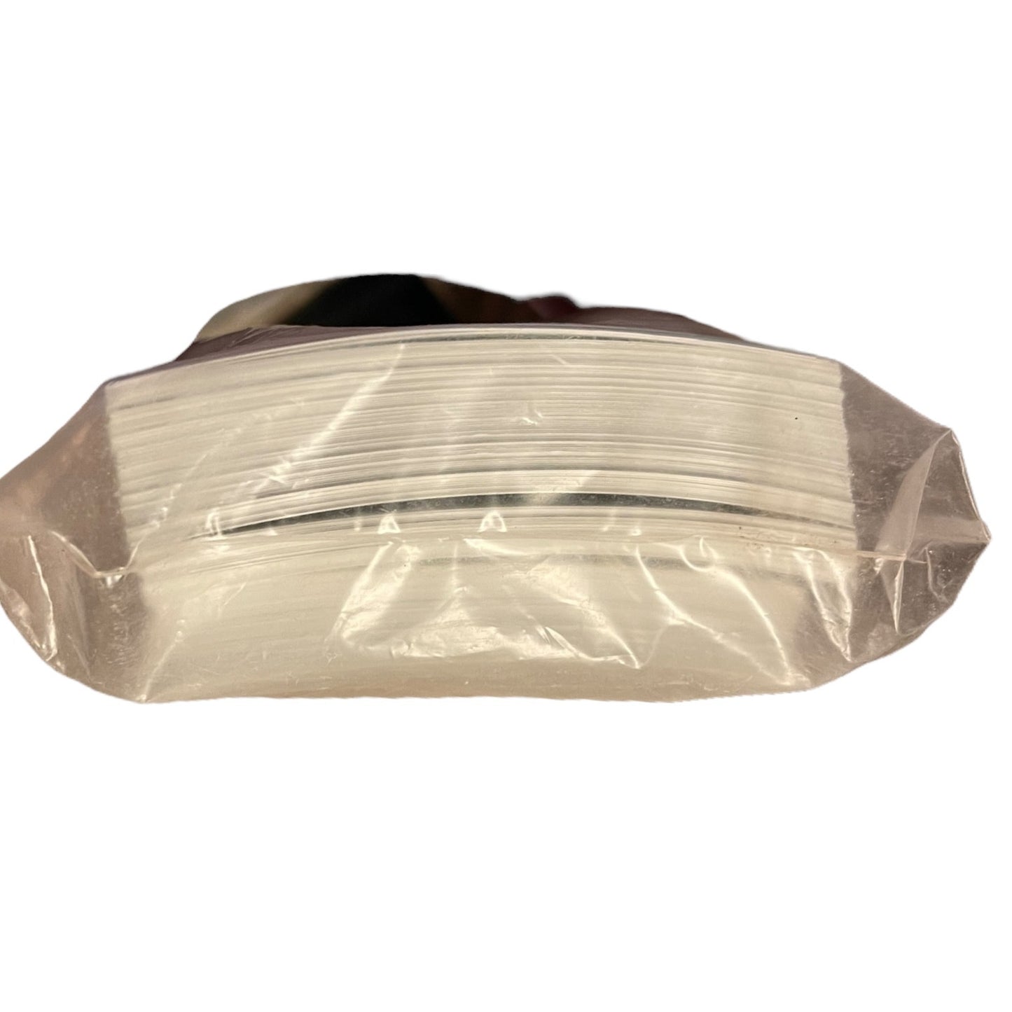 Side view of photo paper in packaging on a white backgrounf