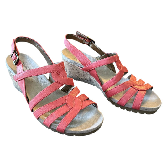 A pair of women's wedge sandals with coral straps, shown on a plain white background.