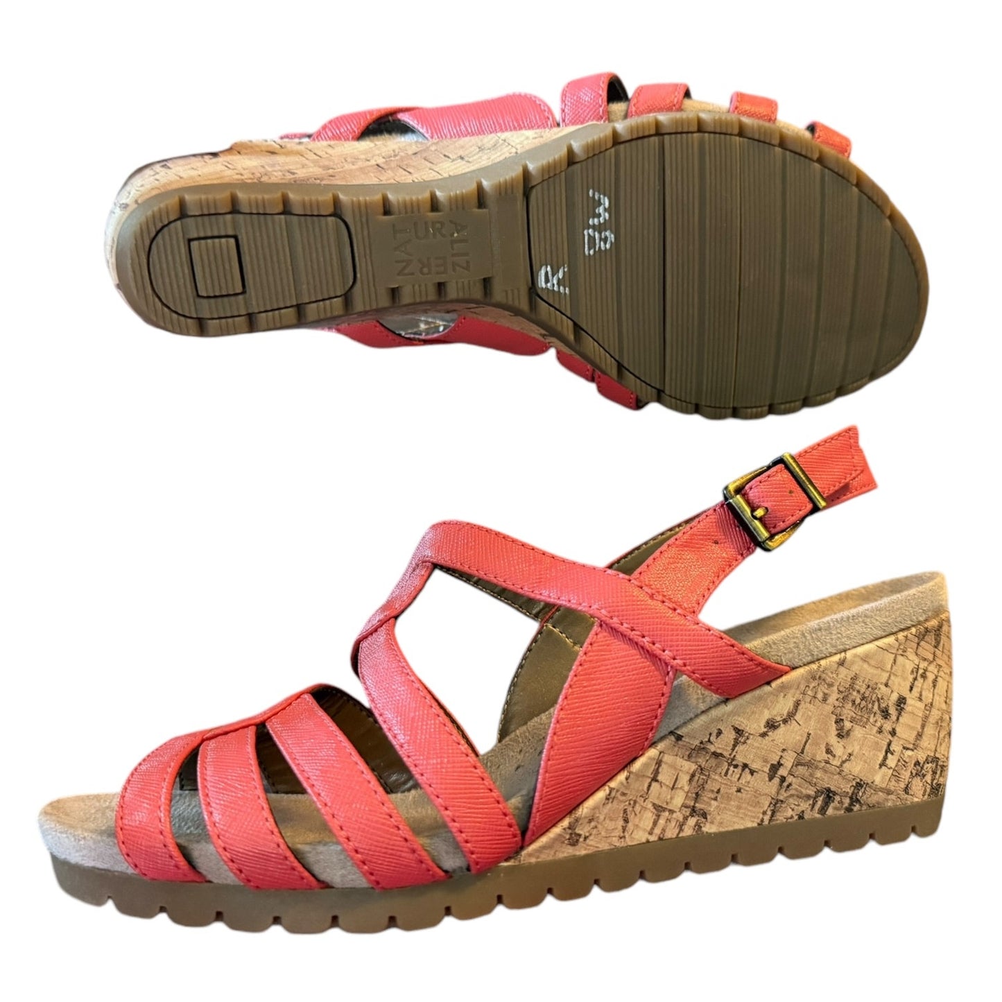 A pair of women's wedge sandals with coral straps and a natural cork wedge heel, shown from two angles on a white background.