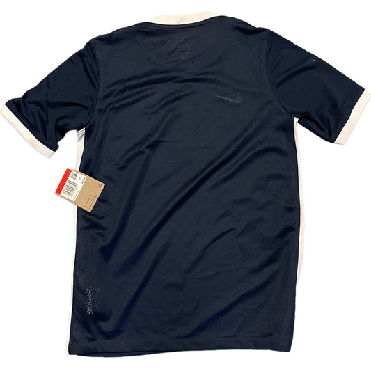 A navy blue short-sleeve athletic shirt with white trim on the collar and sleeve cuffs, shown from the back with a hangtag attached.