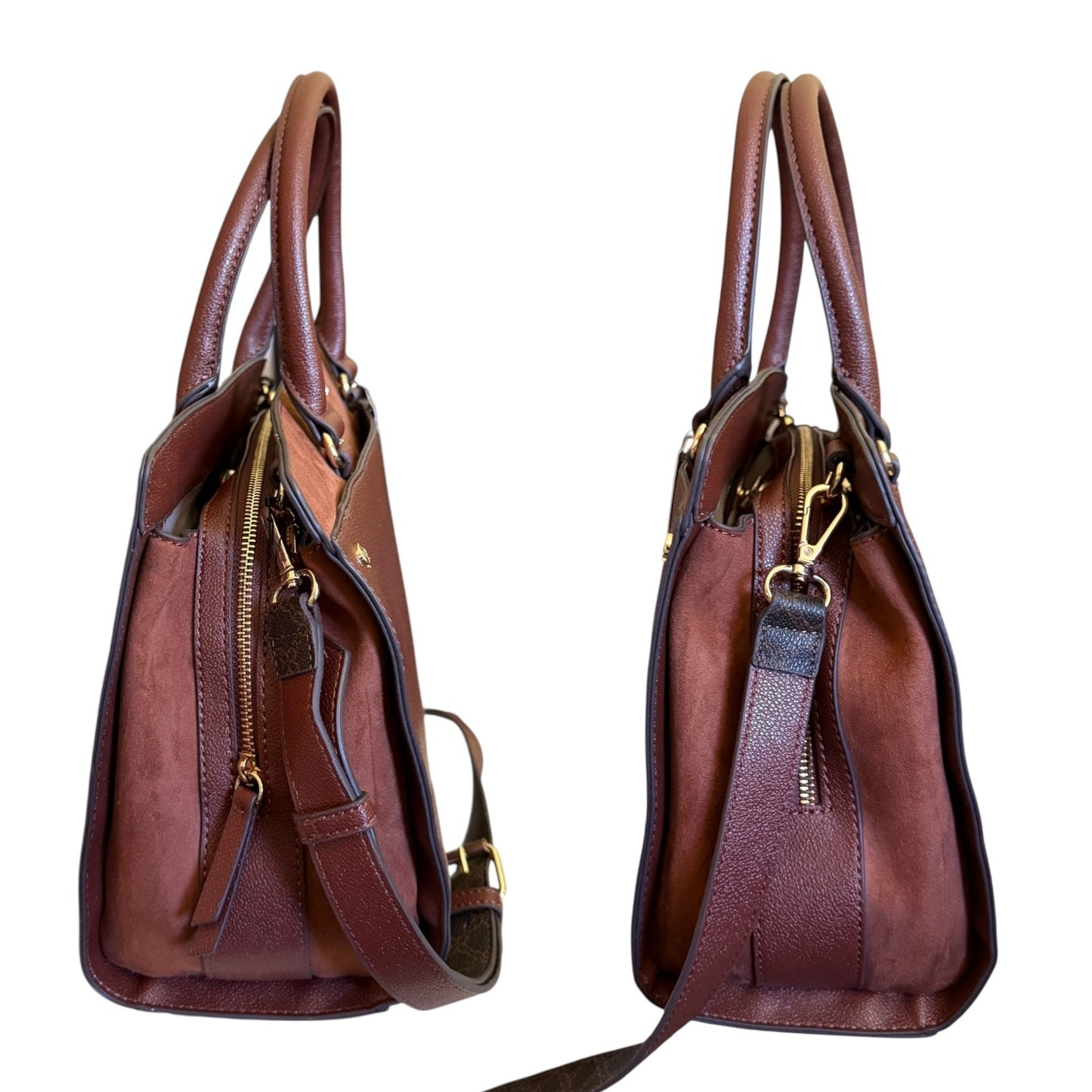 Side view of brown handbag with gold zippers on a white background