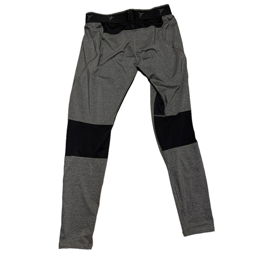 Back of Gray pants with black areas on a white background