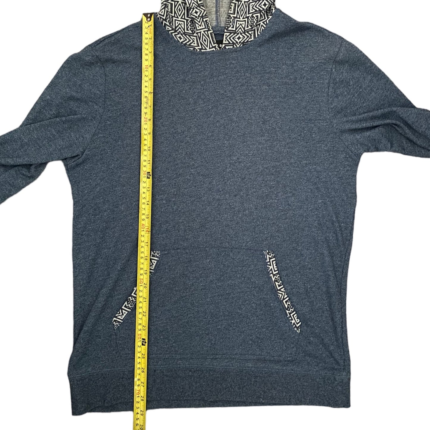 Blue hoodie with a measuring tape for size reference on a white background