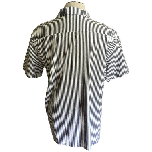 A short-sleeve button-up shirt with vertical black and white stripes, shown from the back on a mannequin torso against a white background.