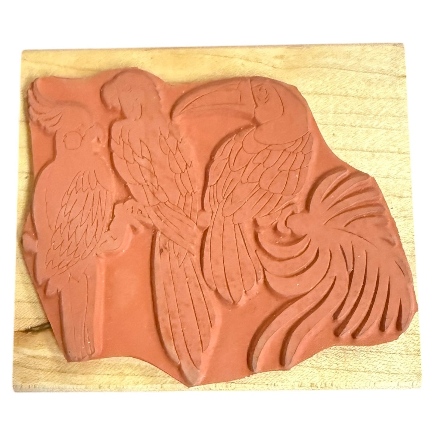 Rubber stamp of bird trio on a wood block on a white background