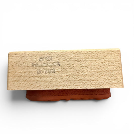 Rectangular wooden block with text on a white background