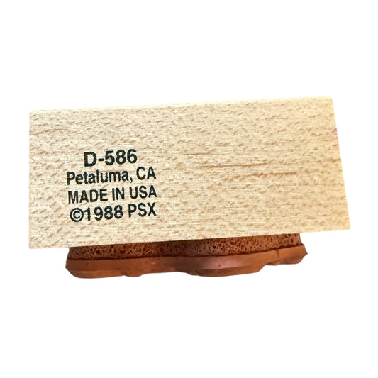 Wooden block with text 'D-586 Petaluma, CA MADE IN USA ©1988 PSX' on a white background