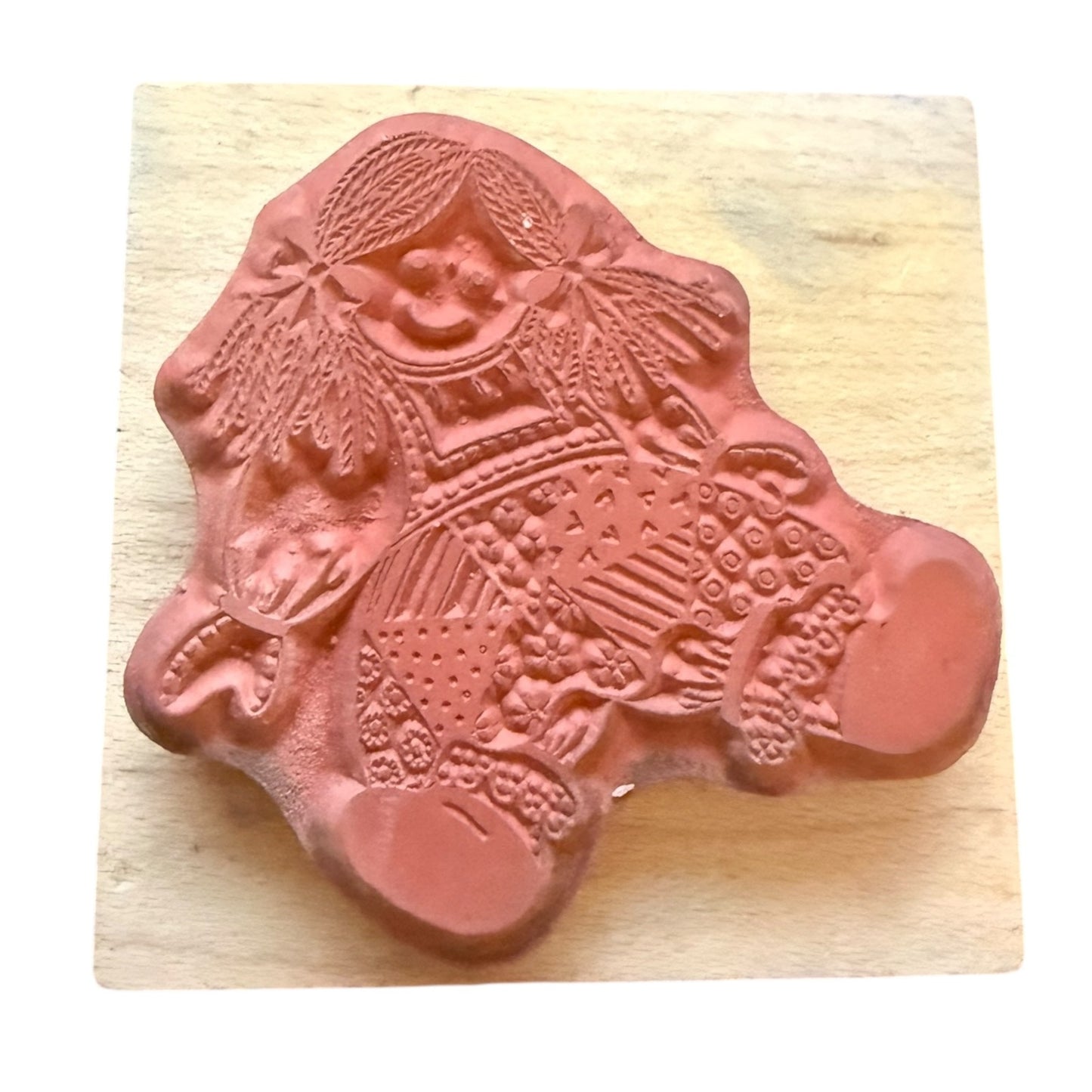 Decorative rubber stamp on a wooden block
