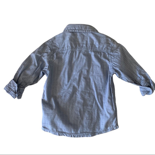 A children's long-sleeve button-up shirt with a fine vertical stripe pattern in blue and white, shown from the back on a white background.