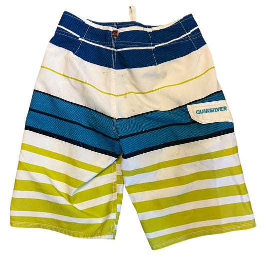 A pair of Quiksilver board shorts featuring horizontal stripes, laid flat against a white background.