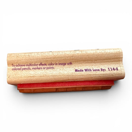 Wooden stamp with red pad on a white background