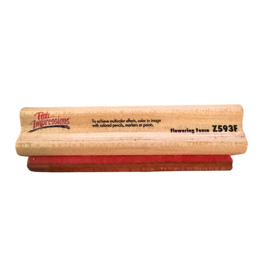 Wooden stamp Z593F with red rubber pad on a white background