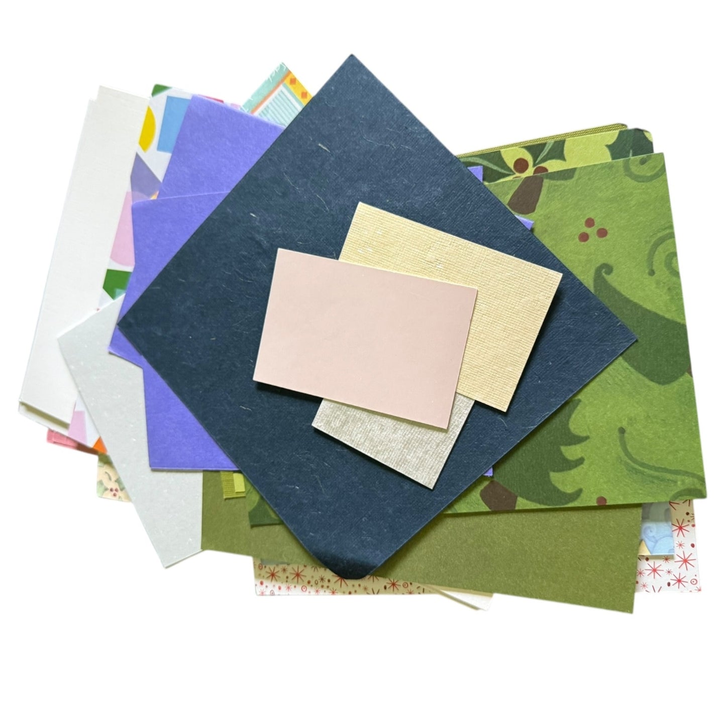 Assorted colorful card stock and paper on a white background
