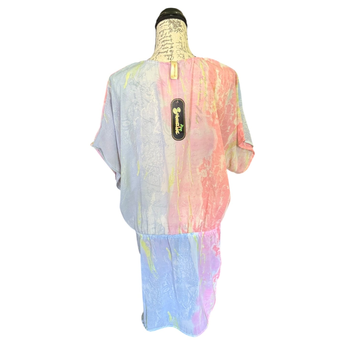 Back of Colorful tie-dye shirt on a mannequin with a white background