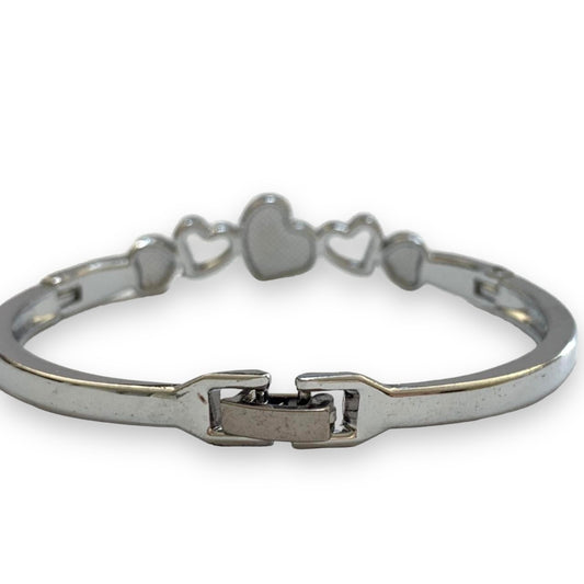 Silver bracelet with heart-shapes and back with clasp on a white background