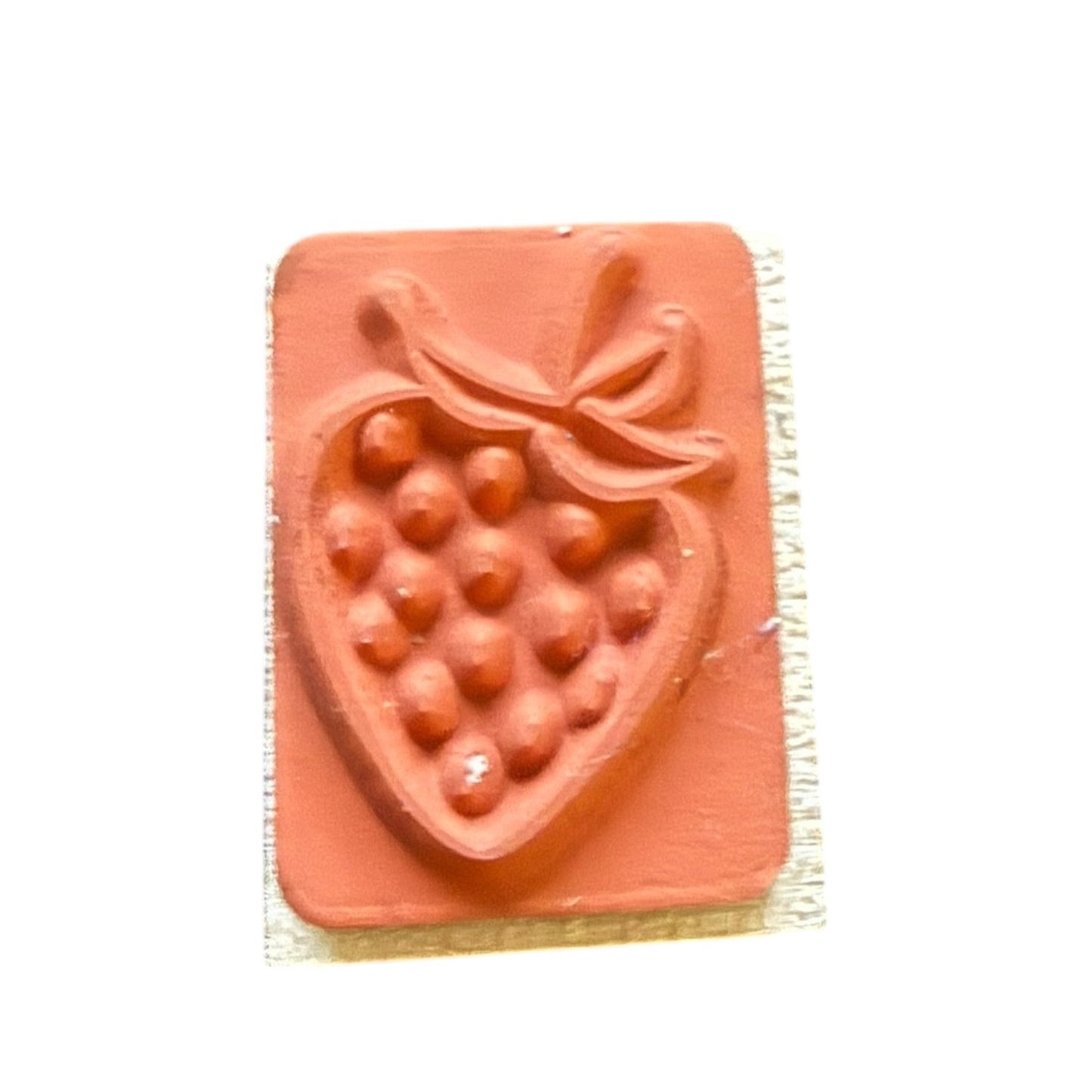 Rectangular stamp with strawberry design on a white background
