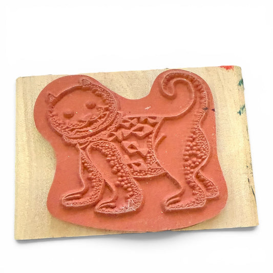 Rubber stamp with a cat design on a wooden block