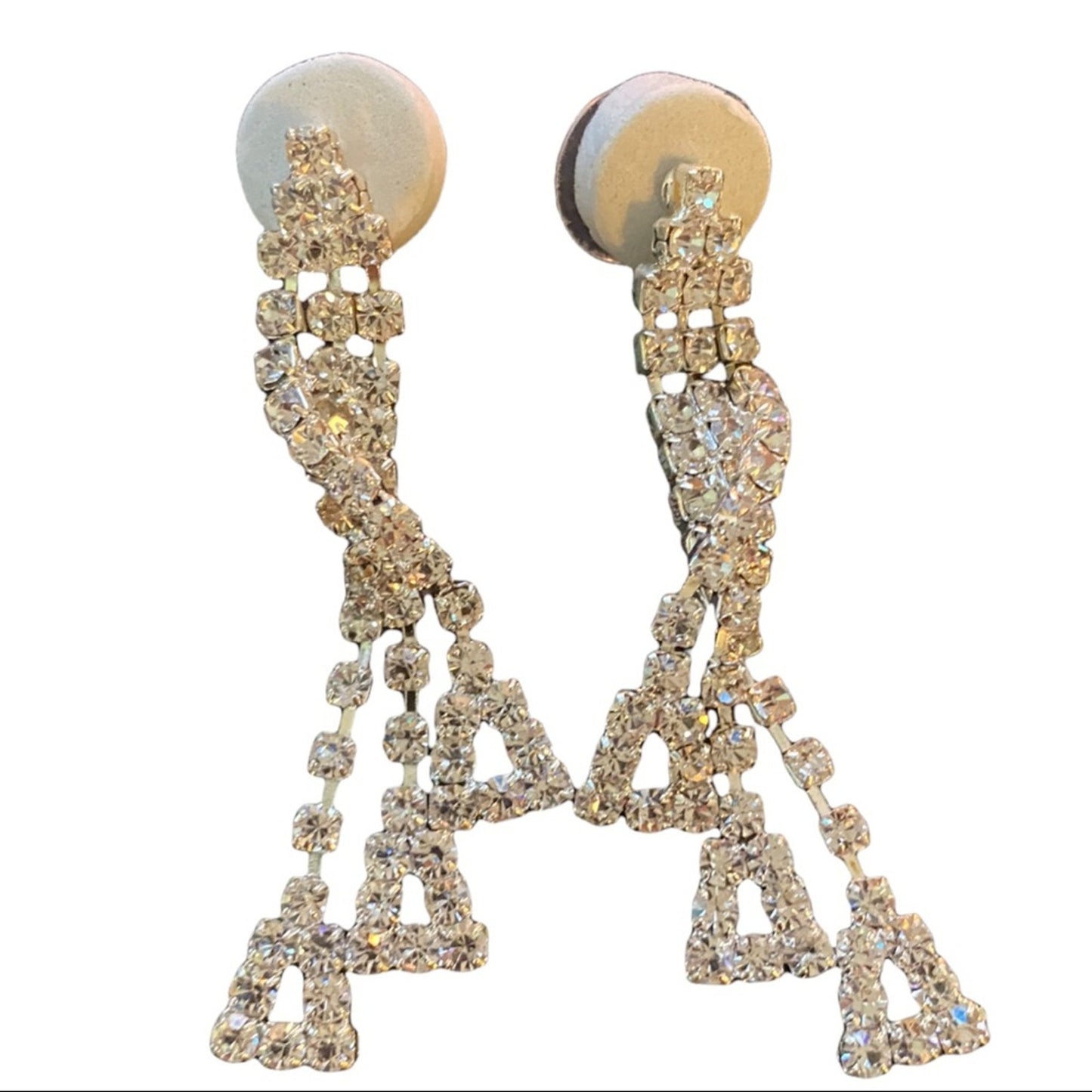 Elegant earrings with rhinestone embellishments on a white background