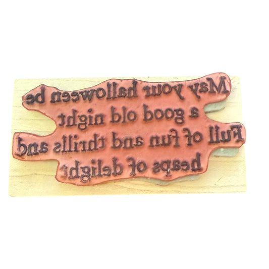 Wooden stamp with engraved text on a wooden background