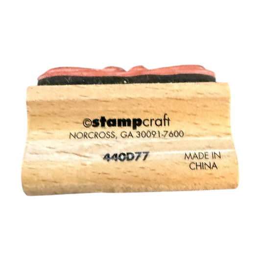 Wooden stamp with red rubber pad on a white background, featuring 'stampcraft' branding.