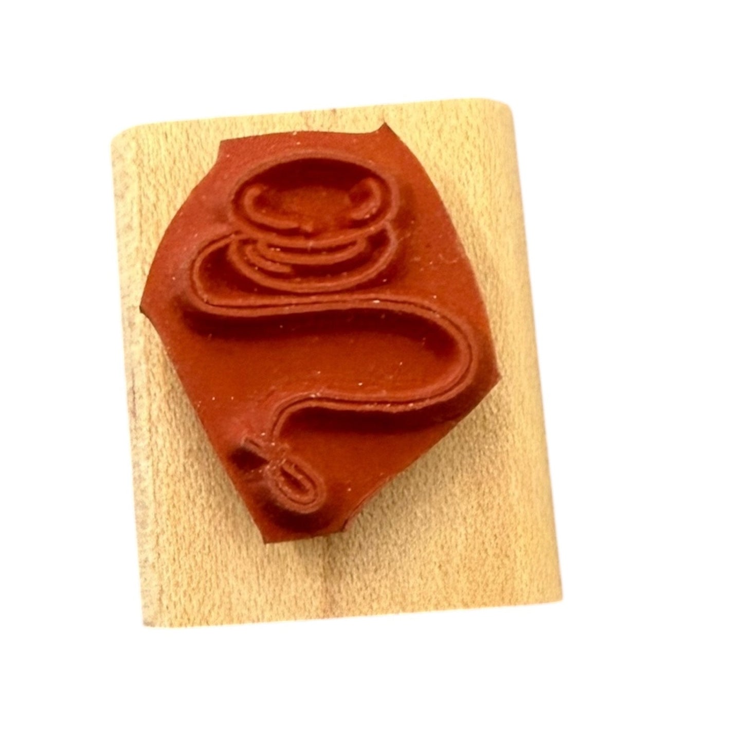 Yo-yo rubber stamp on a wooden block with a white background