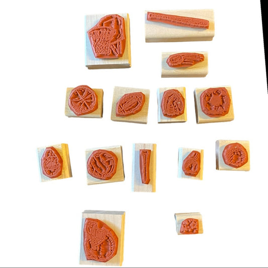 Collection of wooden stamps with various designs on a white background