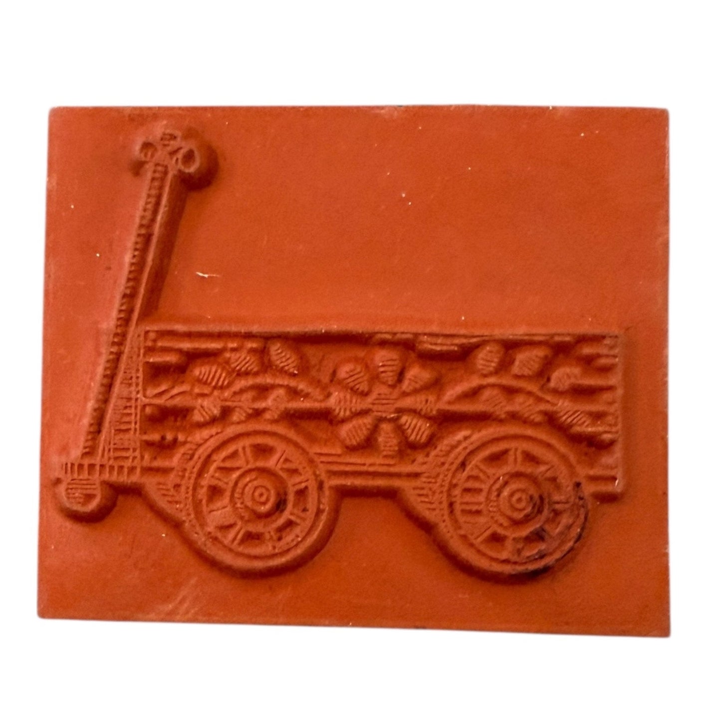 Rubber stamp of a cart with wheels on a white background
