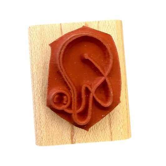 Paddle board stamp on a wooden block