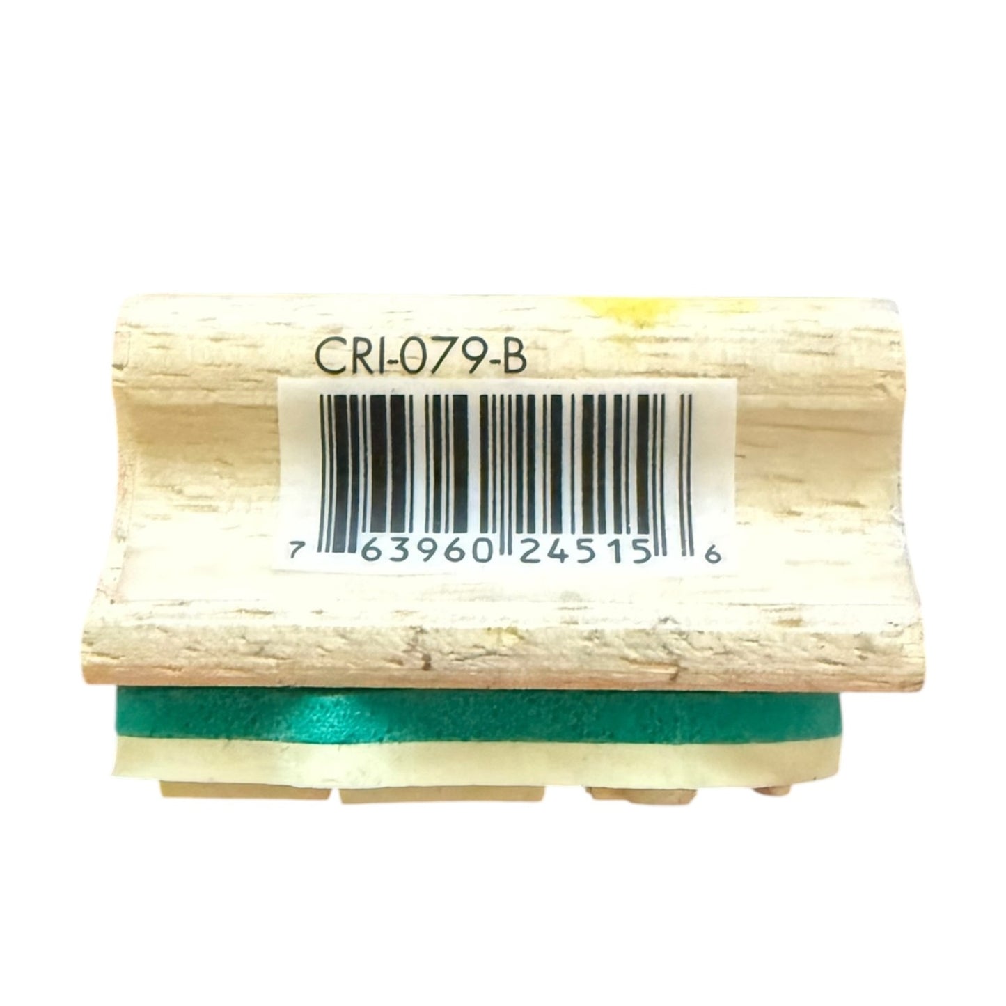 Wood block witu a white barcode label reading CRL-079-B, and a teal-green strip visible along the bottom edge, on a plain white background.