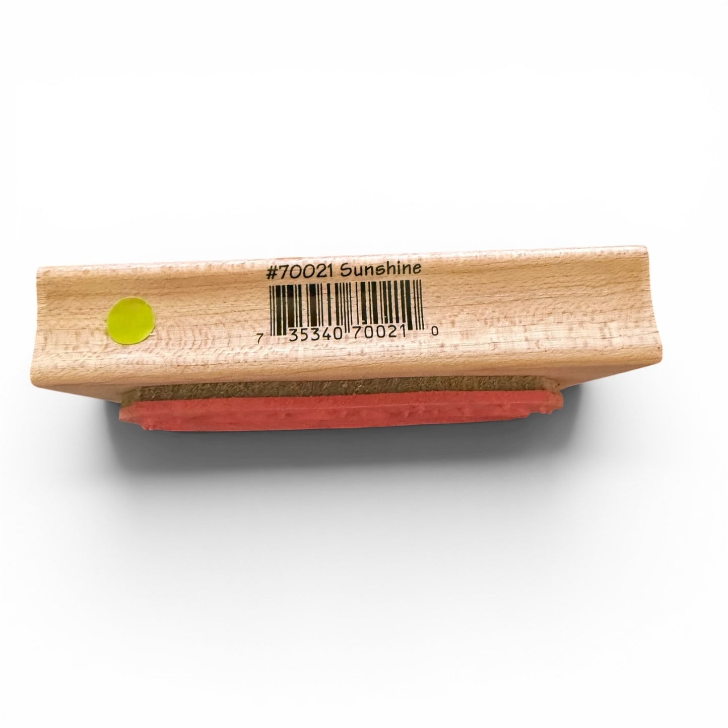 Wooden stamp with a barcode label on a white background