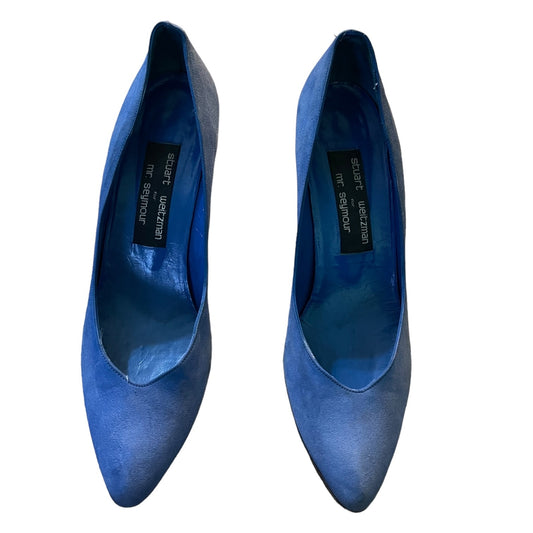 A pair of blue pointed-toe pumps with a suede-like finish, shown from a top-down view on a white background.
