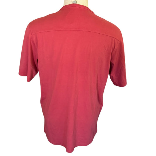 A red short-sleeve shirt displayed on a mannequin torso against a plain white background.