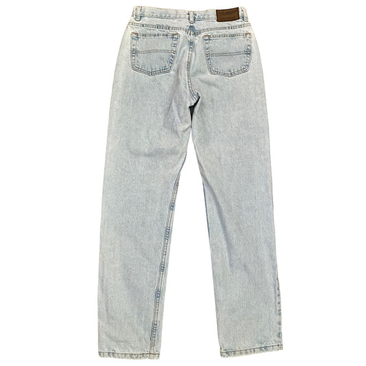 Light wash blue denim jeans shown from the back, featuring a classic five-pocket design and a brown leather brand patch at the waistband.