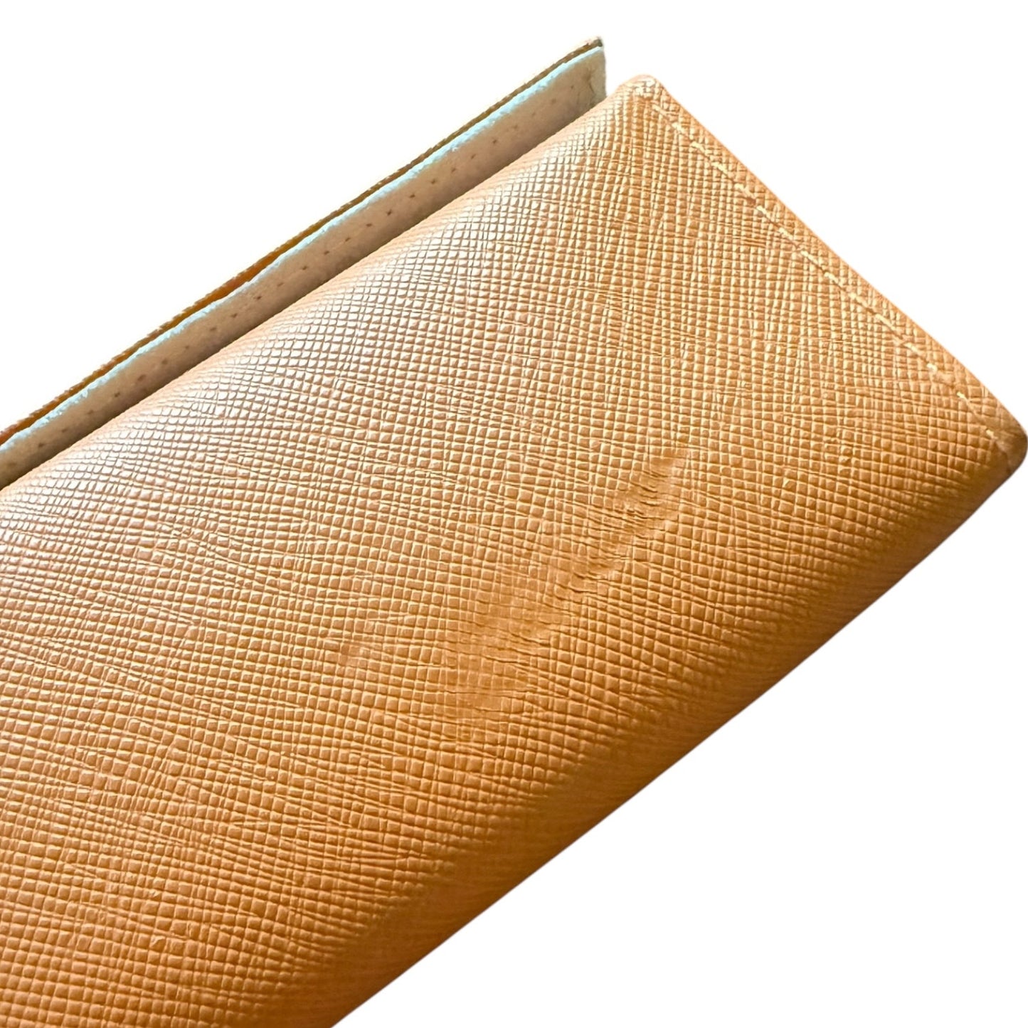 A close-up of a orange textured case with a fine grained pattern, shown against a plain white background.