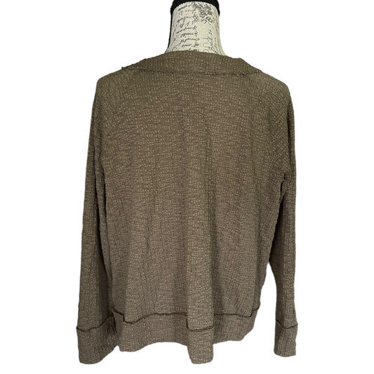 A green textured knit sweater displayed on a mannequin torso against a plain white background.