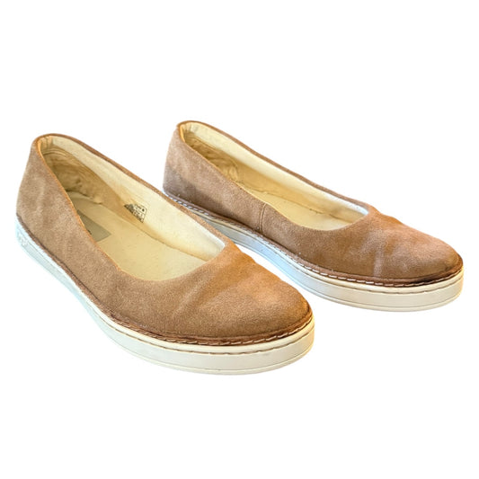 A pair of women's slip-on shoes in light brown suede with white soles, shown against a plain white background.