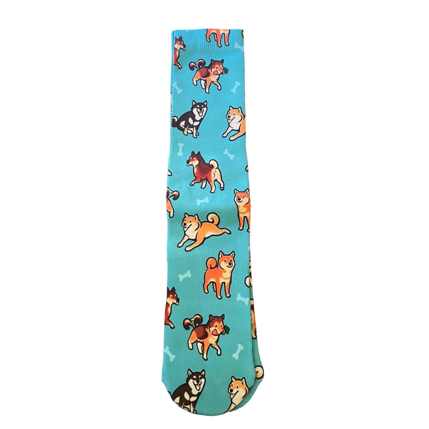 A single crew sock with a bright turquoise blue background, featuring a playful pattern of various dog breeds in orange, brown, black, and white, with small white bone motifs.
