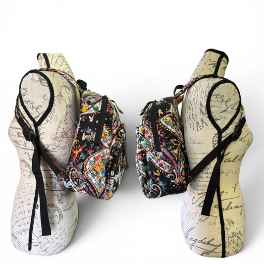 Side view of backpack on mannequin stands against a white background