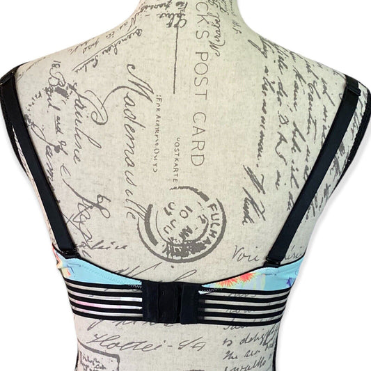 Back of blue floral bra with vintage-style text design on the back