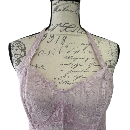 Lace bustier bra top on a mannequin with vintage-style text background